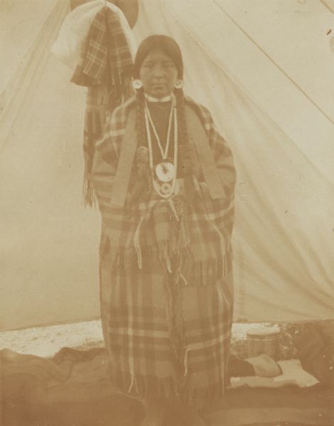 Eda Holloquil, an Indian girl wrapped in a Pendleton blanket, at the Warm Springs Agency in Orgeon.