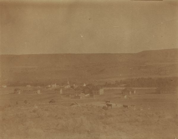 A view of school grounds at the Warm Springs Agency in Oregon shows the water supply and a bluff of over 1000 feet.