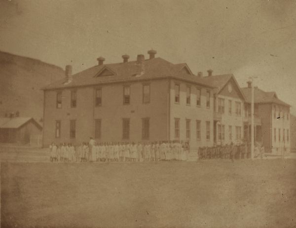 A school dormitory with children marching to dinner at the Warm Springs Agency in Oregon.
