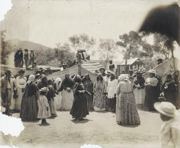 A group of women, possibly Tarahumara Indians, dancing in Mexico.
