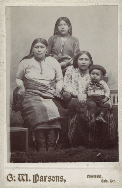 Three Osage women and a child.