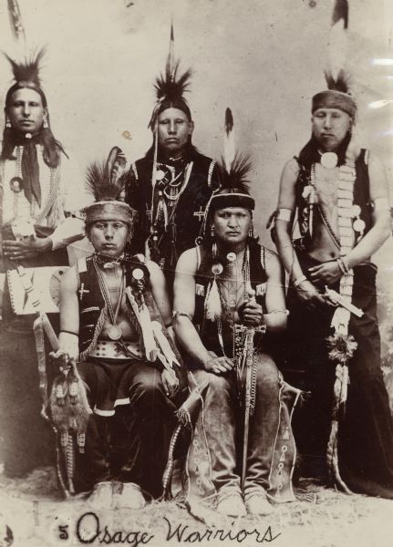A group of Osage warriors. This image comes from an Osage album with the inscription: "Compliments of G.W. Parsons."