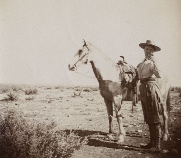 A woman, possibly Sarah Jones, wife of William Arthur Jones, standing with a horse.