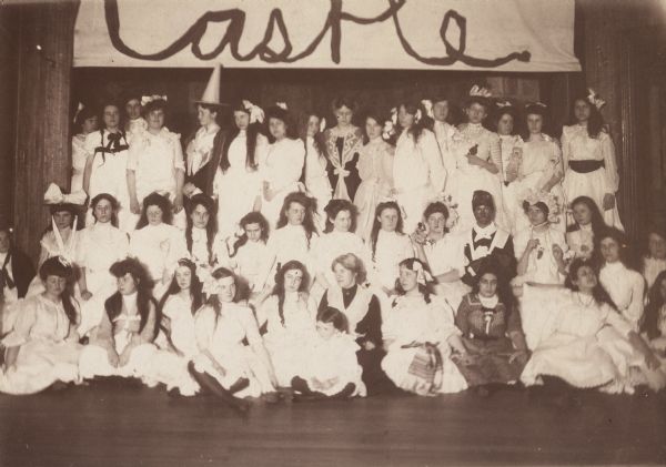 A group of girls, possibly in a school pageant.