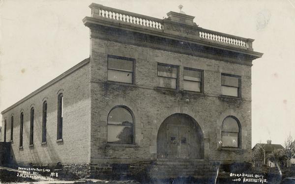 View of the front of the Opera House. Caption reads: "Opera House, Amherst, Wis."