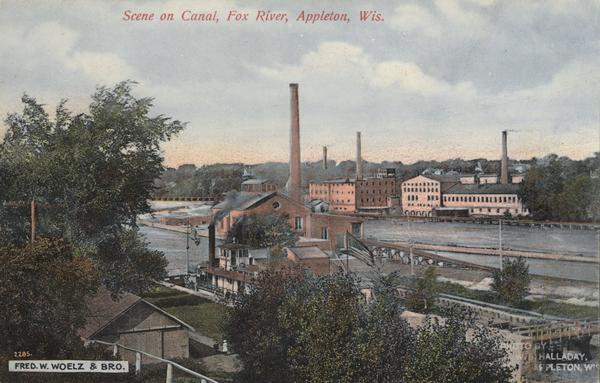 Caption reads: "Scene on canal, Fox River, Appleton, Wis." Elevated view from hill looking down towards the river.
