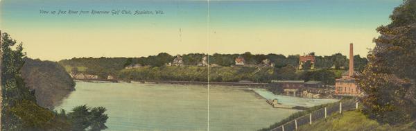 View from hill towards the river, paper mill, and houses on a hill in the distance. Caption reads: "View of Fox River from Riverview Golf Club, Appleton, Wis."