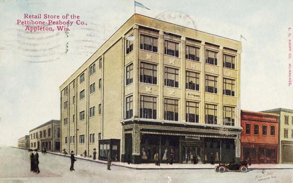 Front view of the Pettibone Peabody retail store. A large store with four stories situated on a corner. An automobile is at the curb and pedestrians on the sidewalk and street. Caption reads: "Retail Store of the Pettibone Peabody Co., Appleton, Wis."