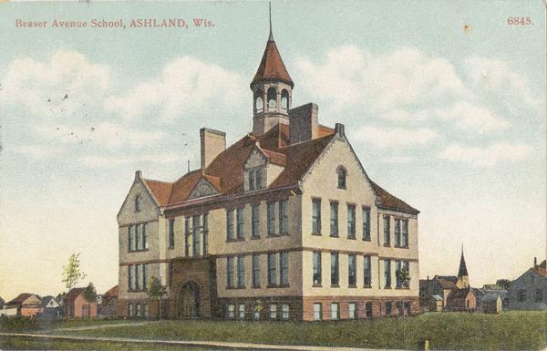 The Beaser Avenue School, built in 1899 of brick and brownstone in the Richardson Romanesque style. In the background are dwellings and a church building. It is listed in the State and National Register of Historic Places. Caption reads: "Beaser Avenue School, Ashland, Wis."