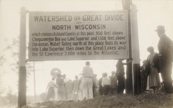 The watershed sign unveiled. The marker is 39 miles south of Ashland adjacent to Highway 13, 2 miles north of Gordon Lake.
