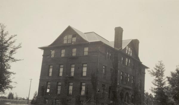 Wheeler Hall at Northland College, a three story building with basement and attic, surrounded by trees. Built in 1893 of red brick and brownstone in the Romanesque Revival style. An extensive Property Record is on the Wisconsin Historical Society website, see "Property Record, 1411 Ellis Ave, Architecture and History Inventory." It is listed on the State and National Register of Historic Places.