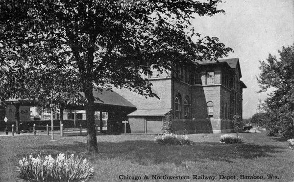 Exterior of Chicago and Northwestern railway depot. Caption reads: "Chicago & Northwestern Railway Depot, Baraboo, Wis."
