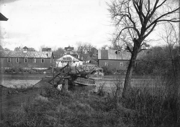 View of the Ringling Brothers Circus winter quarters from across the Baraboo River, looking due north. The brick building, center, was one of the two "Cat Barns" maintained by the Circus.