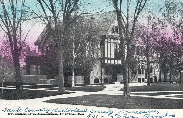 View from street towards the building. Handwritten on postcard: "Sauk County Historical Society Museum, 531 — 4th Ave., Baraboo".