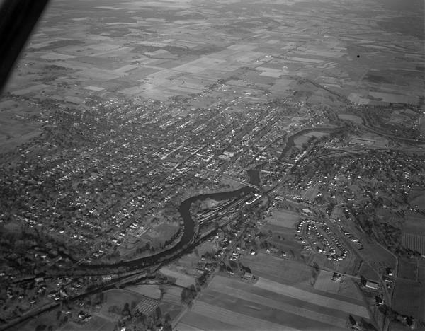 Aerial view of town, with the Baraboo River.