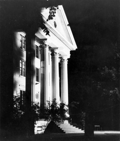 Night view of entrance to Wayland Hall, built in 1855, at Wayland Junior College.