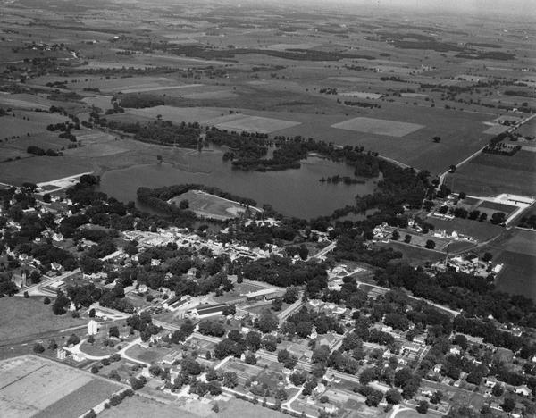 Aerial view of downtown, with fields beyond.