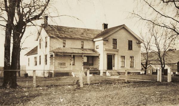 View of what possibly was the William Morehead residence on the bank of the Sugar River.  The original Greek Revival structure was erected in 1858 by Verona carpenter William Close.  The addition to the south facade was built later.