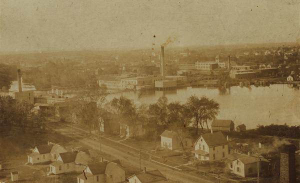 Elevated view over houses towards the industrial area along the Rock River.