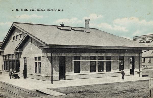 Slightly elevated view of the Chicago, Milwaukee, and St. Paul railway station. Caption reads: "C. M. & St. Paul Depot, Berlin, Wis."