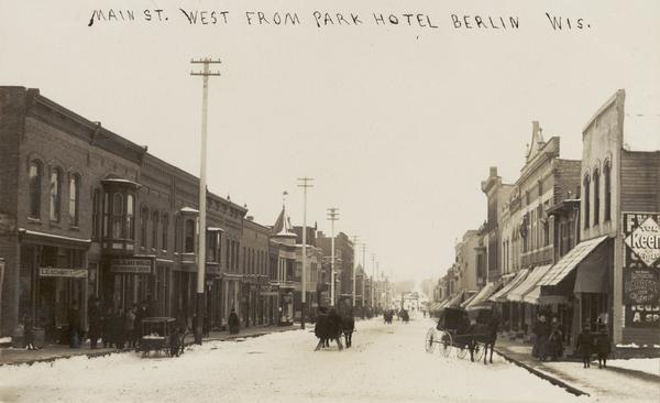 View of Main Street. The handwriting on the photograph reads: "Main St. West from Park Hotel Berlin Wis."