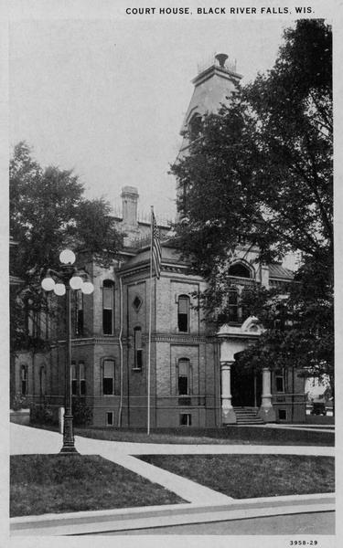 View from street toward the front and left side of the Black River Falls Court House. Caption reads: "Court House, Black River Falls, Wis."