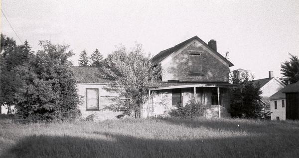 House with typical extension in rear.