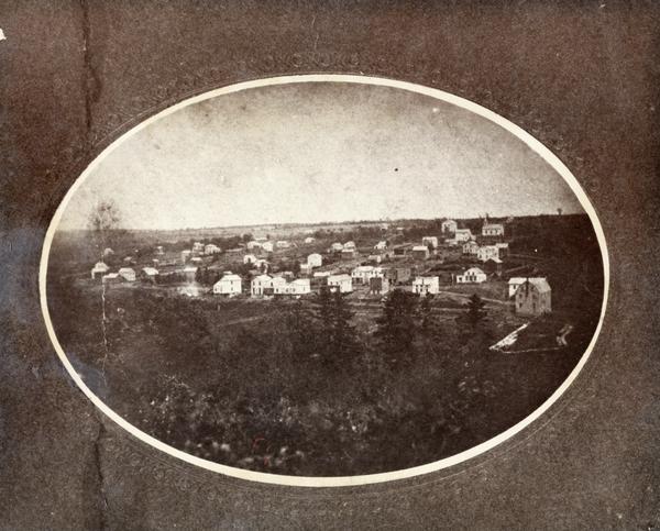 Oval-framed view of the village, founded by Delos W. Taft, had its name changed to Bloomington in 1867. It had been named Tafton.