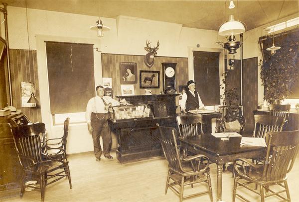 Interior view of the lobby. Two men are standing along the back wall.