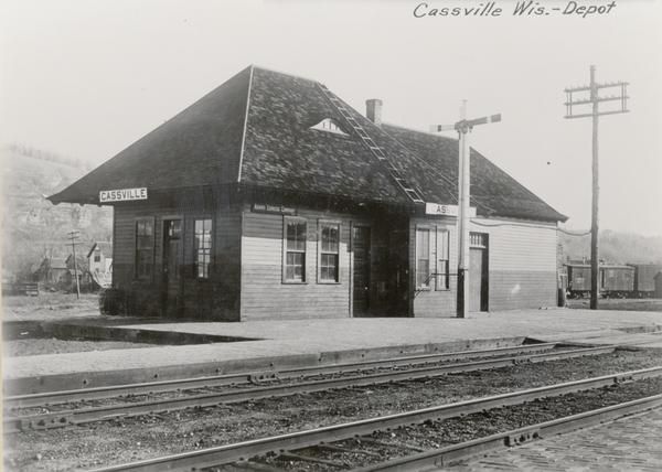 Train Depot, Adams Express Company. Hills are in the background.