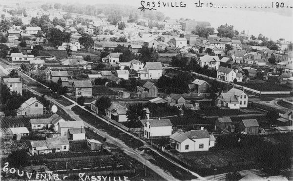 Elevated view of Cassville and its residential area. Bottom text reads: "Souvenir, Cassville." Written at top right: "Cassvie Wis..... 190__."