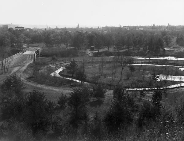Chippewa Falls with a park and river in the foreground.