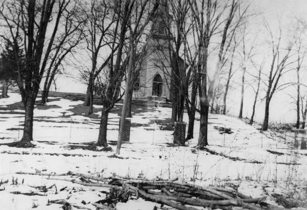 German Evangelical Association Church with snow-covered foreground. The church was located near the community of Hope in Blooming Grove Township, Dane County.  It was dismantled between 1943 and 1949.