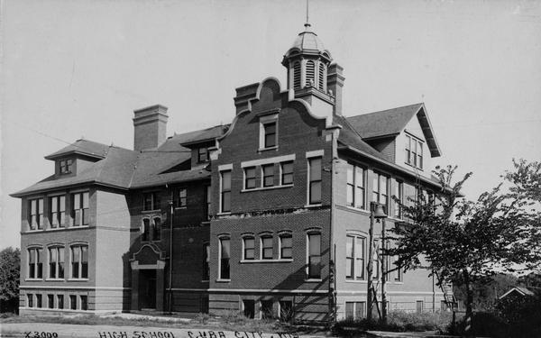 Caption reads: "High School, Cuba City, Wis." Exterior view of the high school.