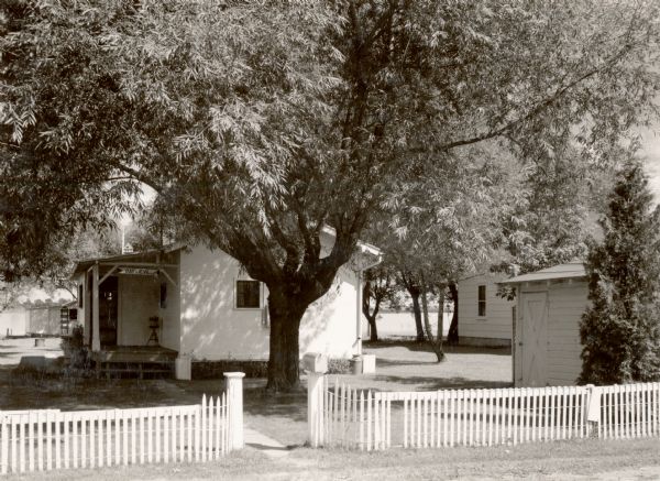 A small house with a white picket fence. Bayview Cottage.