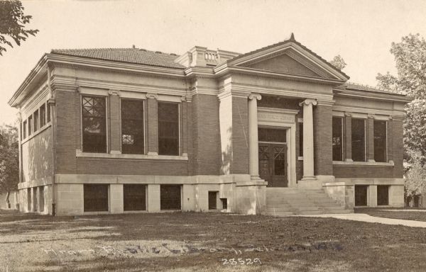 Front view of the library. Caption reads: "Aram Public Library, Delavan Wis."