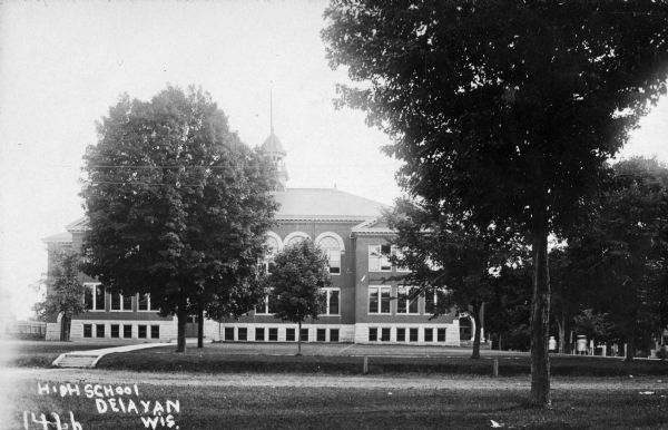 Exterior view of the high school. Caption reads: "High School Delavan Wis."