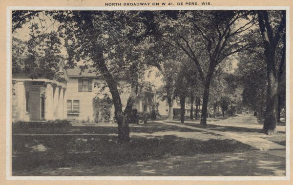View of a residential neighborhood. Caption reads: "North Broadway on W 41, De Pere, Wis."