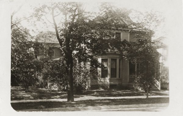 View from street towards the residence during the spring or summer. Home of William K. Coffin family.