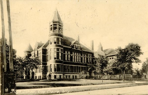 View across street towards the high school. Caption reads: "High School, Eau Claire, Wis."