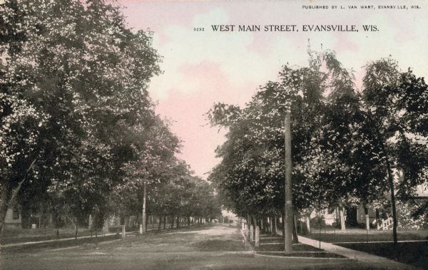 View down tree-lined West Main Street. Caption reads: "West Main Street, Evansville, Wis."