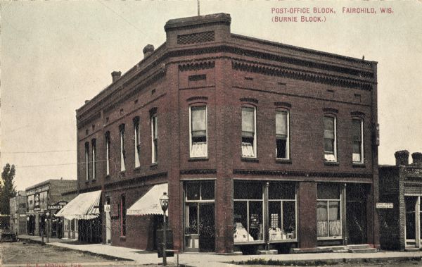View of the post office block, otherwise known as the Burnie block. Caption reads: "Post-Office Block, Fairchild, Wis. (Burnie Block.)"