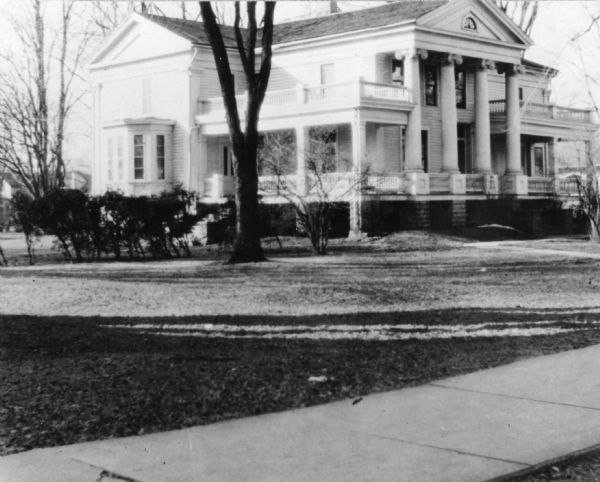 View of a large house of Greek Architecture, with Corinthian pillars or columns. Built by John S. McDonald, and later owned by the McMillan estate. General U.S. Grant was entertained here.