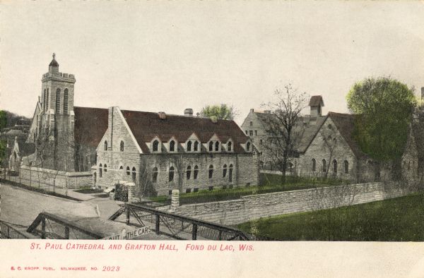 View over bridge towards St. Paul Cathedral and Grafton Hall. Caption reads: "St Paul Cathedral and Grafton Hall, Fond du Lac, Wis."