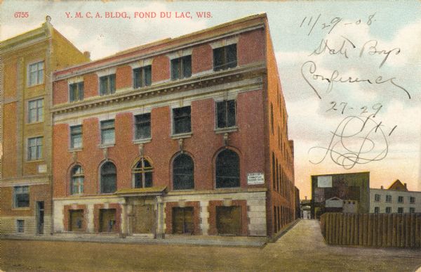 Front view of the Y.M.C.A. building, with an alley on the right. Caption reads: "Y.M.C.A. Bldg, Fond du Lac, Wis."