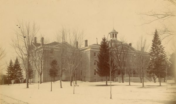 View of Downer College. Snow is on the ground.