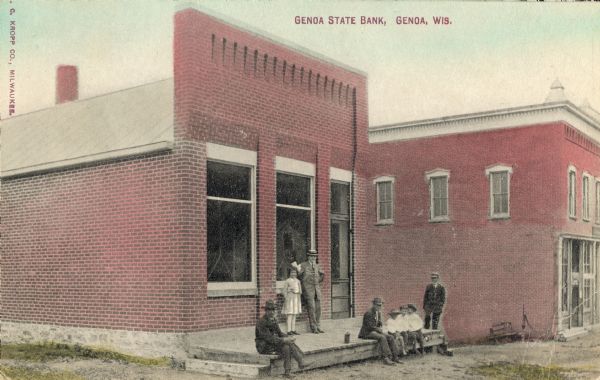 Genoa State Bank with a small group of people gathered on its porch. Caption reads: "Genoa State Bank, Genoa, Wis."