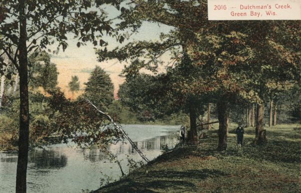 View people standing on the shoreline of Dutchman's Creek. Caption reads: "Dutchman's Creek, Green Bay, Wis."