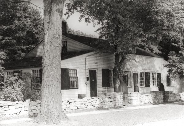 View of the Tank cottage. The cottage was built about 1803 by Joseph Roi, a fur trader, who lived in it until 1805 when it was purchased by Jacques Porlier.  In the mid-19th century the Tank family purchased it. The Brown County Historical Society and the South Side Improvement Association both owned the cottage at one time, and 1975 it became a part of Heritage Hill State Historical Park.