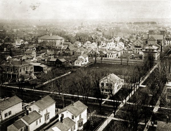 Elevated view of South Jefferson and Doty Streets, showing the Albert Weiss and Platt Greene residences and the present location of the Columbus Club, Kellogg Library, and Neville Museum.